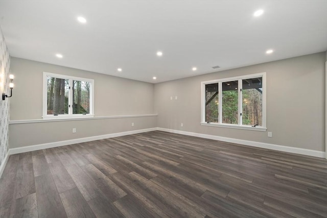 empty room featuring dark hardwood / wood-style flooring