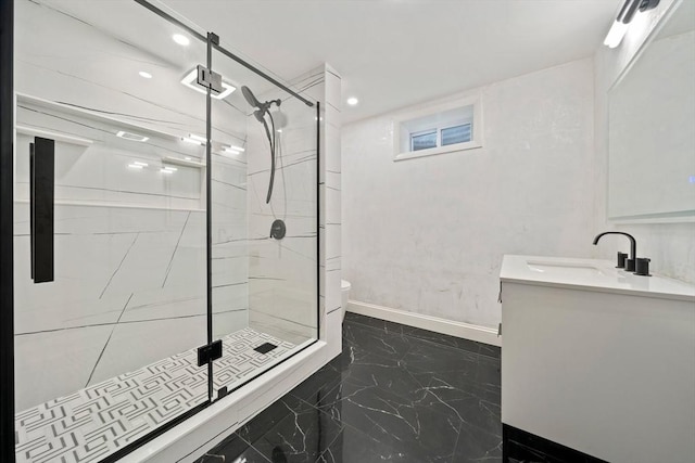 bathroom featuring walk in shower, vanity, and toilet