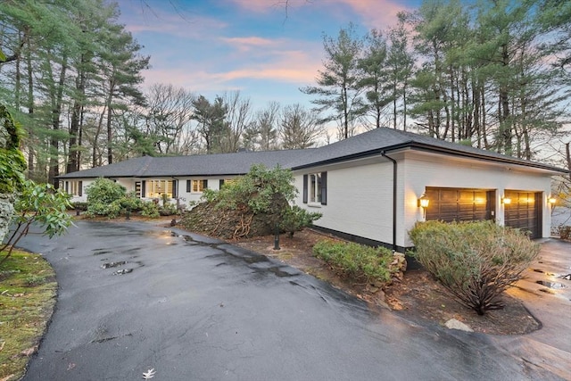 ranch-style house featuring a garage