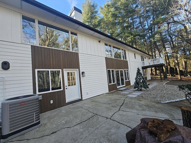 rear view of house featuring a patio area and central air condition unit