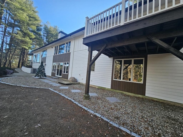 view of home's exterior with a wooden deck