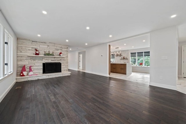 unfurnished living room featuring hardwood / wood-style floors and a fireplace