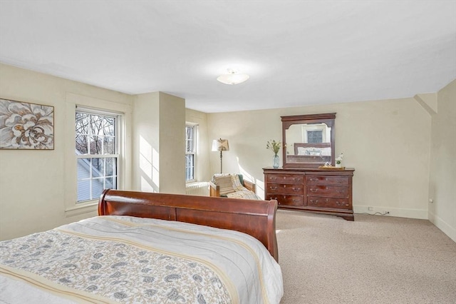 bedroom with carpet flooring and baseboards