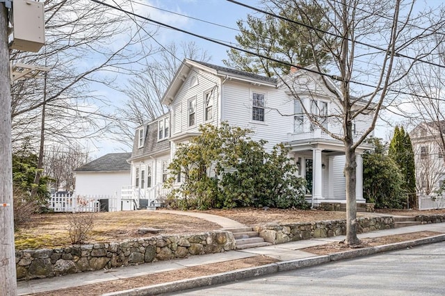 view of front of house with fence