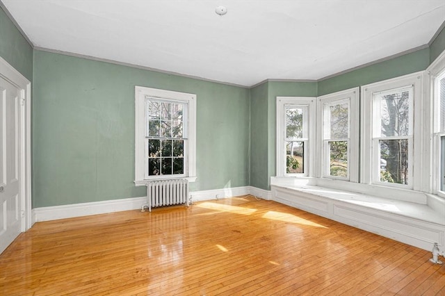 unfurnished sunroom featuring radiator