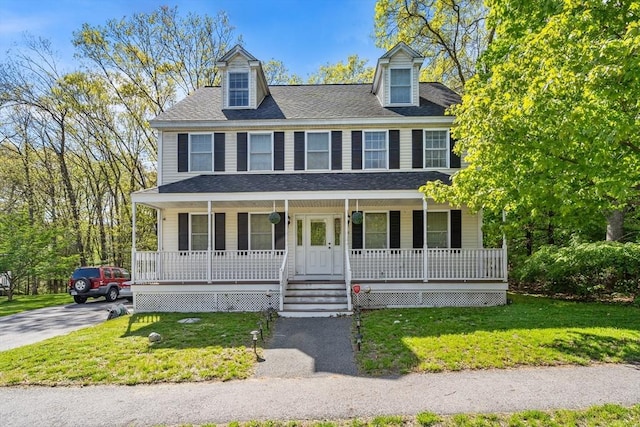 view of front of house with covered porch and a front yard