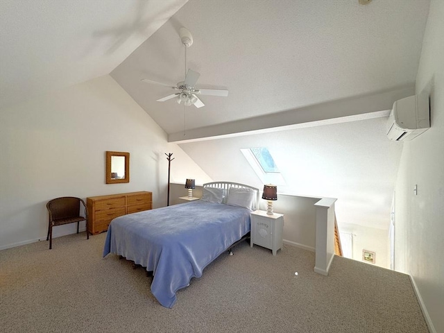 bedroom with carpet, baseboards, vaulted ceiling with skylight, ceiling fan, and a wall mounted air conditioner