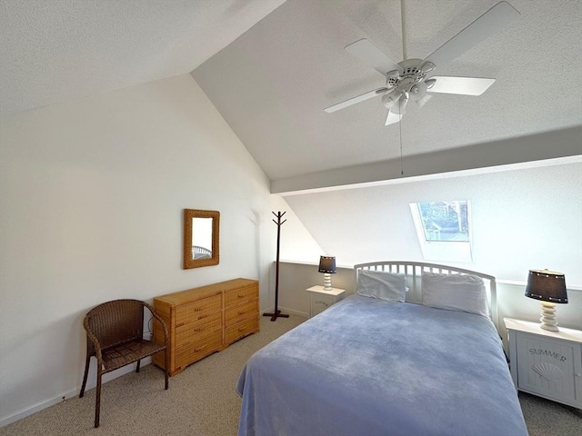 carpeted bedroom with baseboards, a textured ceiling, lofted ceiling, and a ceiling fan