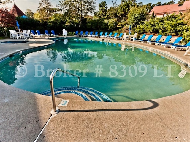 pool with a patio area