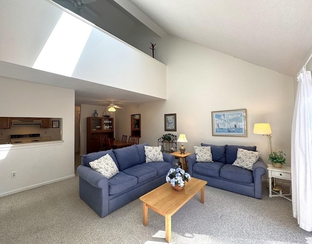 living room with baseboards, high vaulted ceiling, a ceiling fan, and carpet