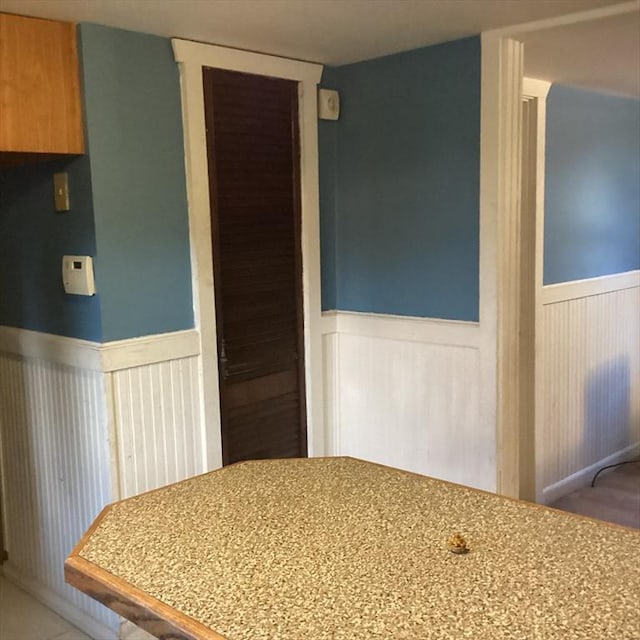 interior space featuring tile patterned flooring and a closet