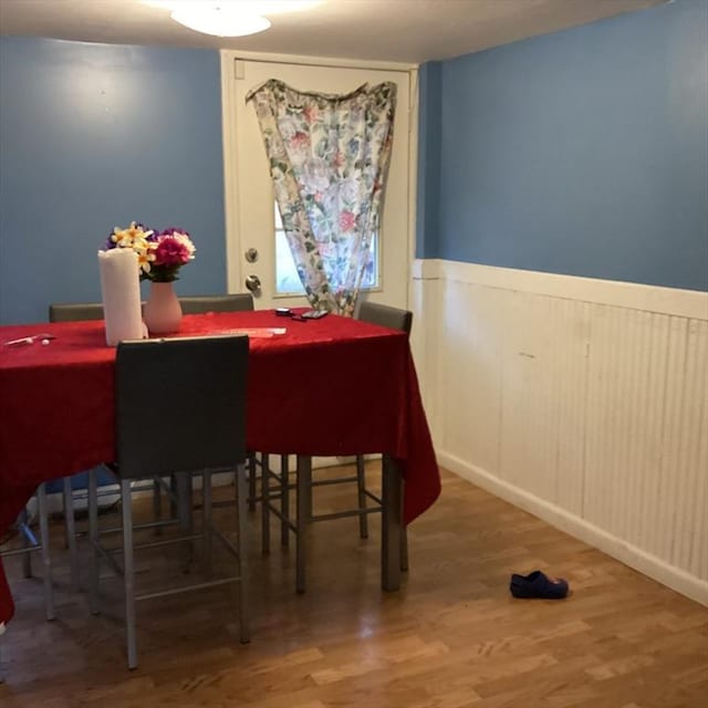 dining space featuring wood-type flooring