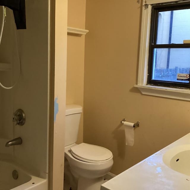 full bathroom with vanity, bathtub / shower combination, and toilet