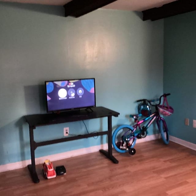 workout room with wood-type flooring