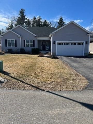 ranch-style house with an attached garage and driveway