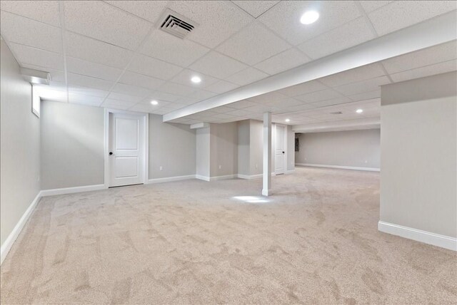 basement with light colored carpet