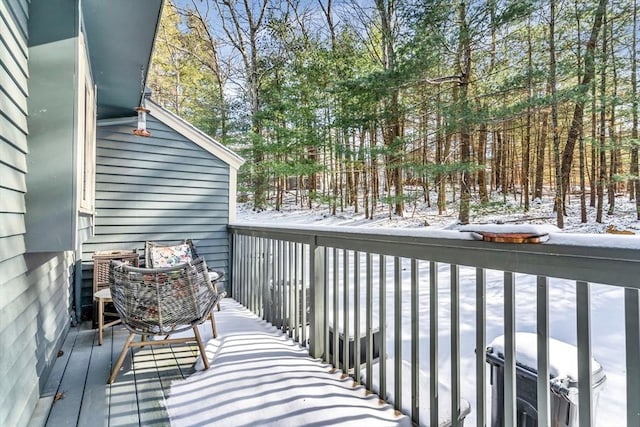 snow covered deck featuring a grill