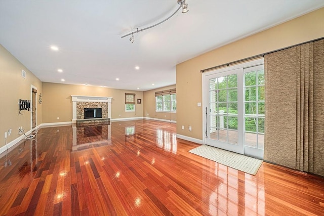 6 Northey Farm Rd, Scituate, MA 02066 - unfurnished living room with wood finished floors, a fireplace, and recessed lighting
