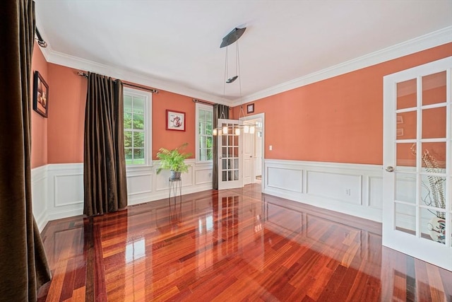 6 Northey Farm Rd, Scituate, MA 02066 - spare room with wainscoting, ornamental molding, a decorative wall, and wood finished floors