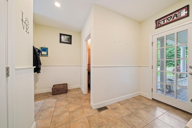 6 Northey Farm Rd, Scituate, MA 02066 - doorway with a wainscoted wall and light tile patterned floors
