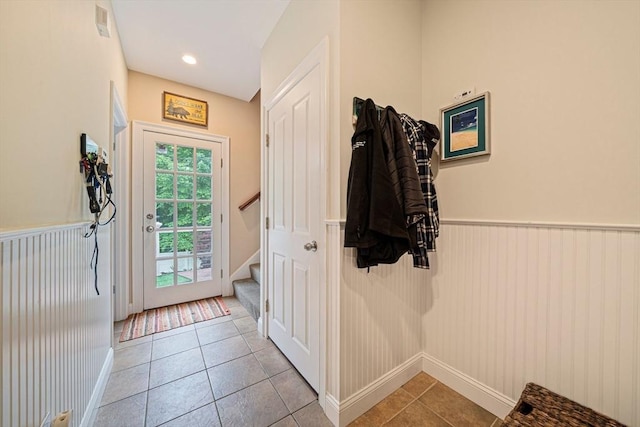6 Northey Farm Rd, Scituate, MA 02066 - entryway with wainscoting, stairs, and light tile patterned floors