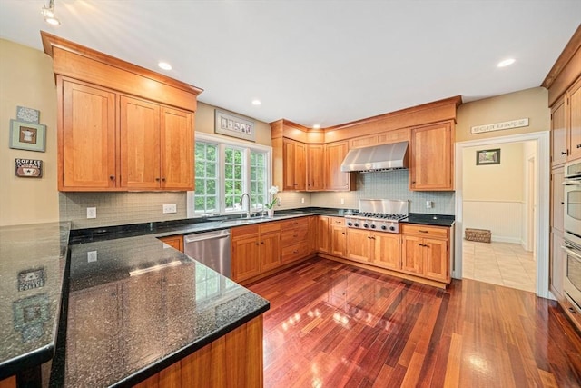 6 Northey Farm Rd, Scituate, MA 02066 - kitchen featuring stainless steel appliances, wall chimney exhaust hood, dark wood-style floors, tasteful backsplash, and recessed lighting
