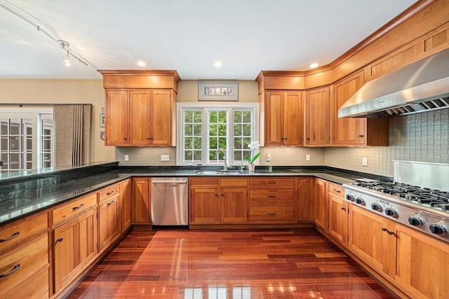6 Northey Farm Rd, Scituate, MA 02066 - kitchen featuring stainless steel appliances, range hood, dark wood-style flooring, backsplash, and brown cabinetry