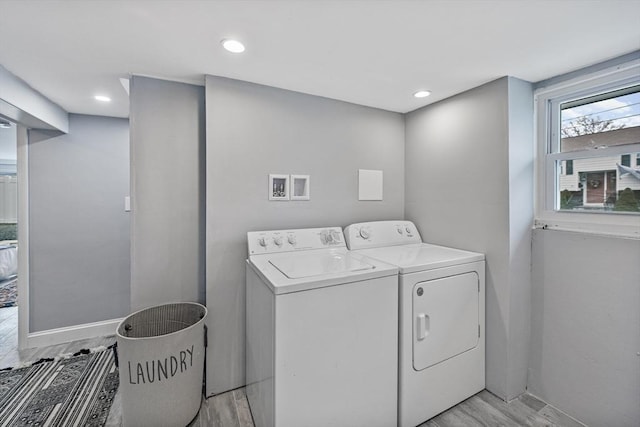 laundry room featuring washer and dryer, laundry area, light wood-style flooring, and recessed lighting