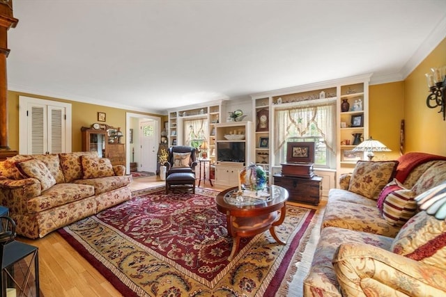 64 E Main St, Middleboro, MA 02346 - living area featuring wood finished floors, plenty of natural light, built in shelves, and crown molding