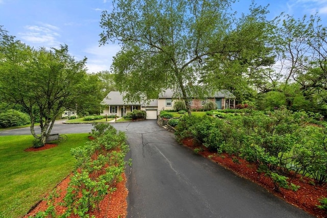 64 E Main St, Middleboro, MA 02346 - view of front of home with asphalt driveway, an attached garage, and a front yard