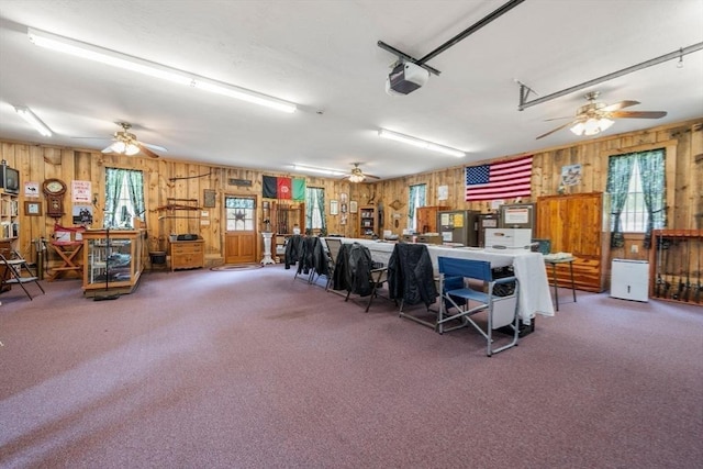 64 E Main St, Middleboro, MA 02346 - garage with wood walls, a ceiling fan, and a garage door opener