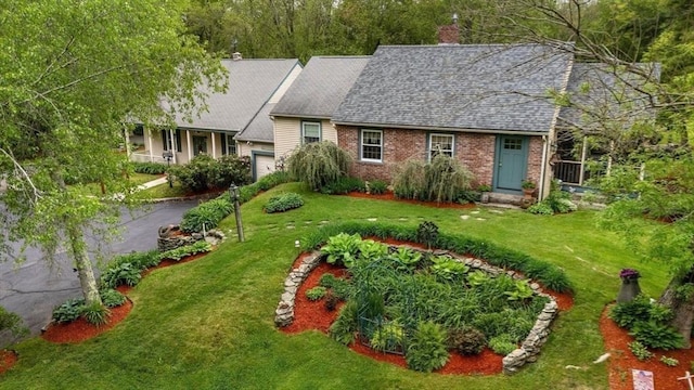 64 E Main St, Middleboro, MA 02346 - view of front of property with an attached garage, a front lawn, brick siding, and a shingled roof