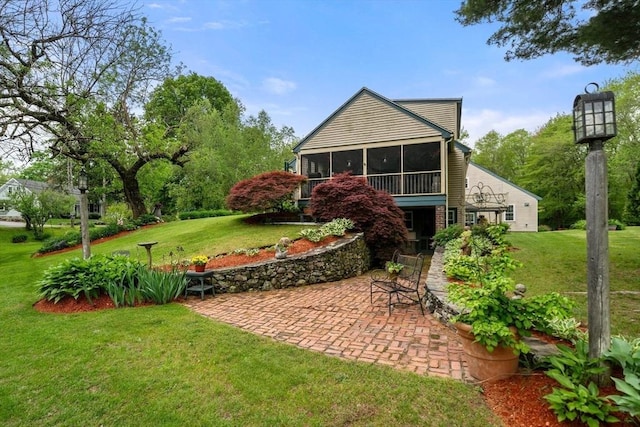 64 E Main St, Middleboro, MA 02346 - rear view of property featuring a patio, a sunroom, and a yard