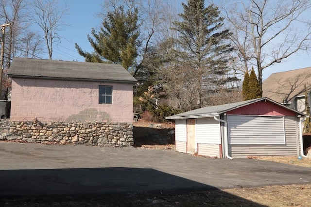 detached garage featuring driveway