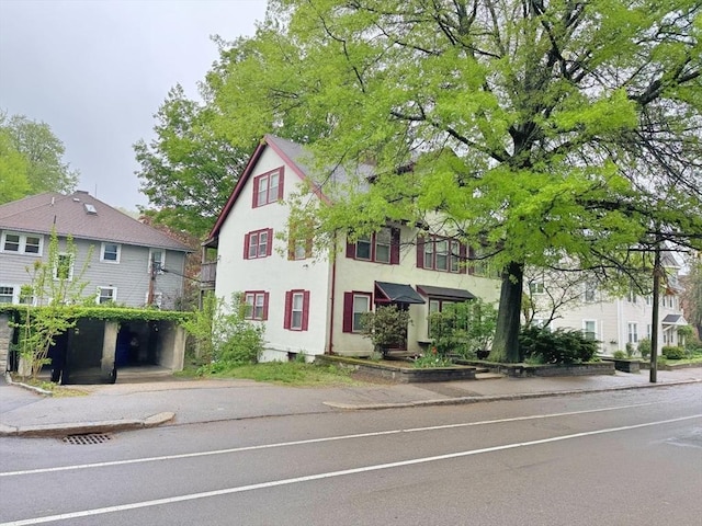 589-591 Washington St, Brookline, MA 02446 - view of front of home featuring stucco siding