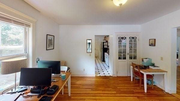 589-591 Washington St, Brookline, MA 02446 - office space featuring light wood-style flooring, french doors, and baseboards