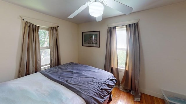 589-591 Washington St, Brookline, MA 02446 - bedroom featuring light wood finished floors, baseboards, and ceiling fan