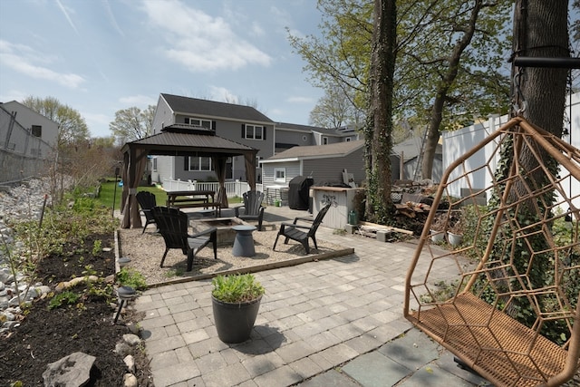 view of patio / terrace with a gazebo, grilling area, and an outdoor fire pit