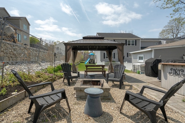 view of patio / terrace featuring a gazebo and an outdoor fire pit