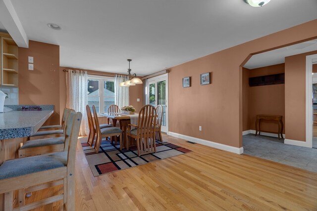 dining area with light hardwood / wood-style flooring