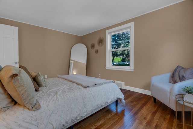 bedroom featuring dark hardwood / wood-style flooring