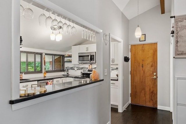 7 Longwood Dr Unit 212, Andover, MA 01810 - kitchen featuring stainless steel appliances, dark countertops, dark wood-type flooring, white cabinets, and decorative light fixtures