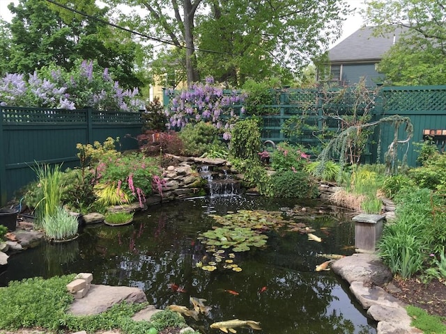 view of yard with a garden pond