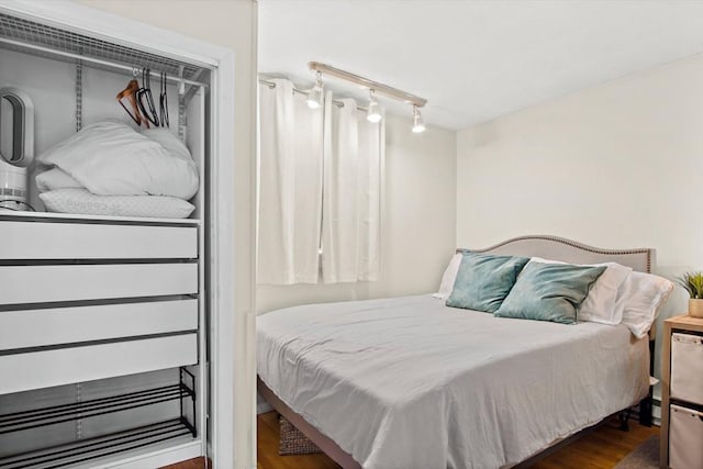 bedroom featuring dark hardwood / wood-style floors