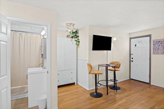 entrance foyer featuring light wood-type flooring and sink