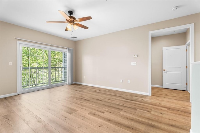 unfurnished room featuring ceiling fan, a smoke detector, light wood-type flooring, and baseboards
