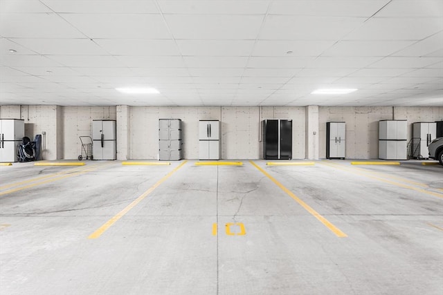 parking deck featuring freestanding refrigerator