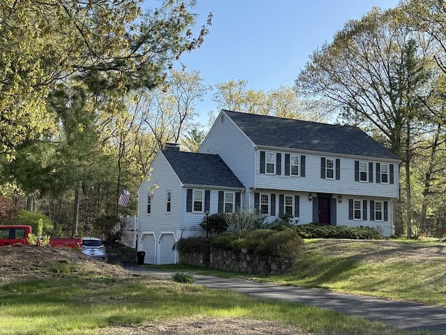 6 J William Hts, Millis, MA 02054 - colonial home featuring a chimney, an attached garage, roof with shingles, and driveway