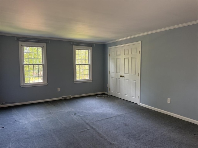 6 J William Hts, Millis, MA 02054 - unfurnished bedroom with ornamental molding, dark carpet, and a closet