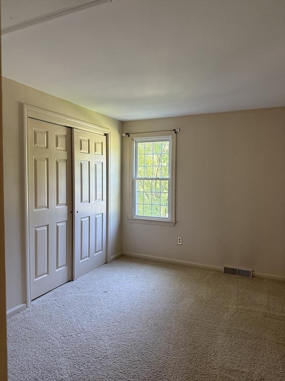 6 J William Hts, Millis, MA 02054 - unfurnished bedroom with carpet flooring and a closet